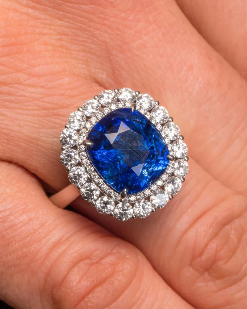 Ceylon sapphire ring with a double diamond halo, worn