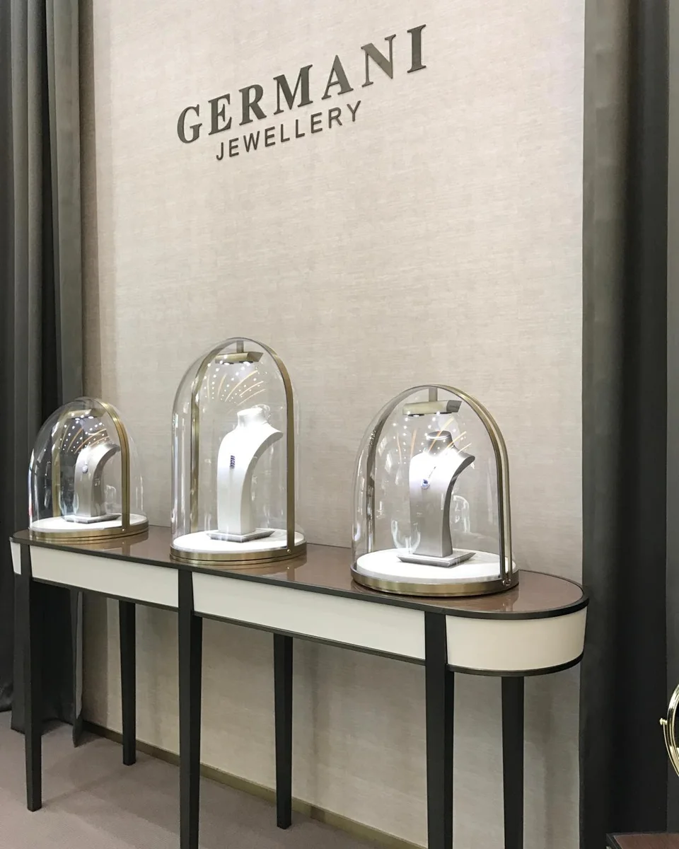 Germani Jewellery pieces displayed under glass domes in the showroom