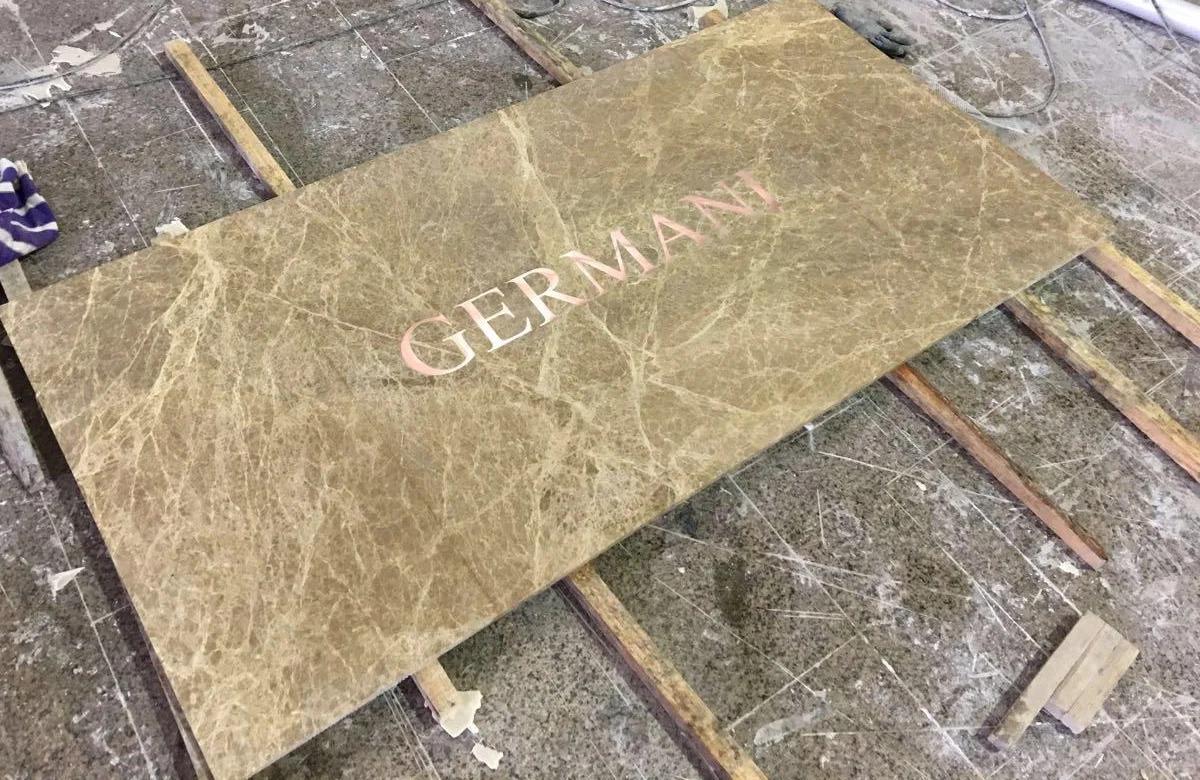 The Germani name inlaid in a slab of marble