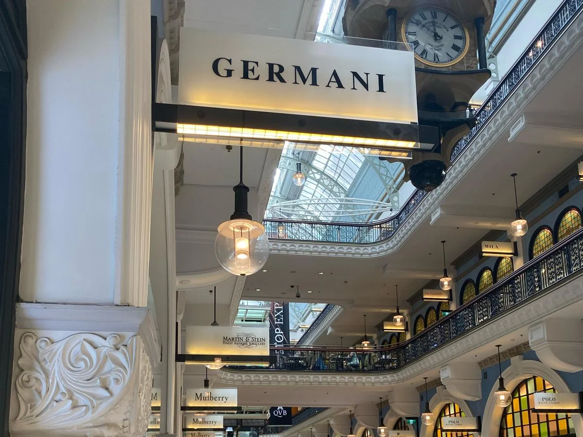 The Germani sign hanging in the Queen Victoria Building arcade beside the great clock