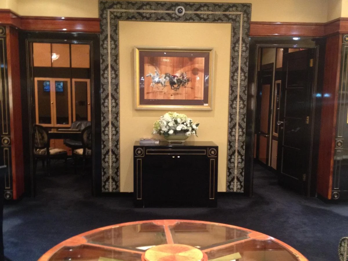 The Germani salon with a round glass display table