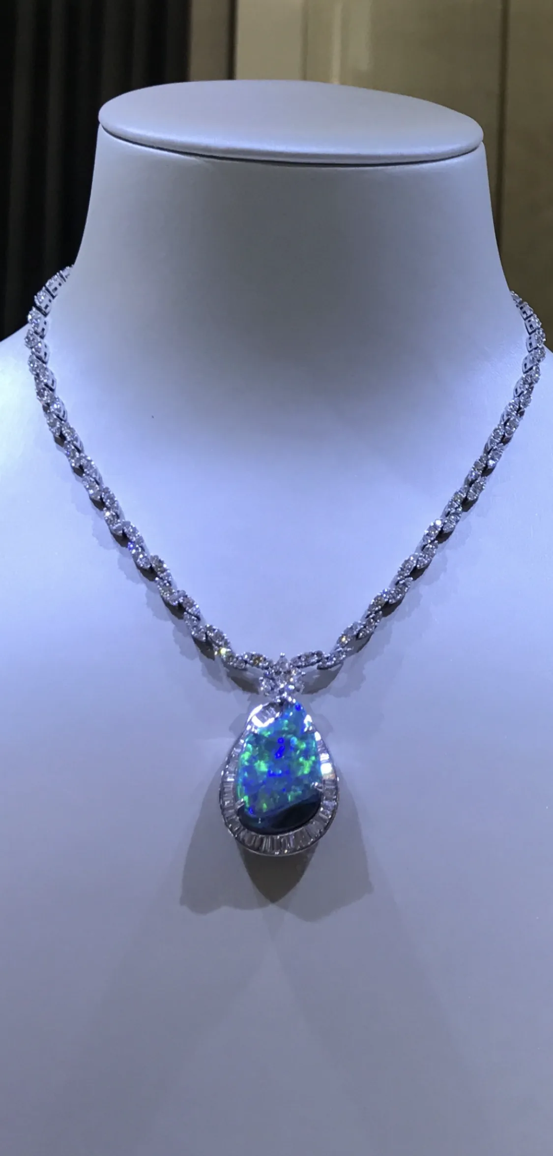 Black opal pendant on display