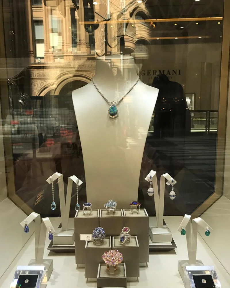 Germani window display with a black opal pendant, coloured gemstone rings and earrings