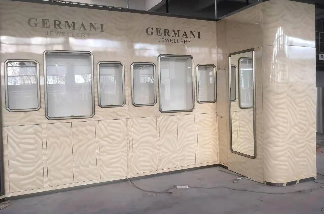The wave-patterned Germani boutique wall assembled in the workshop
